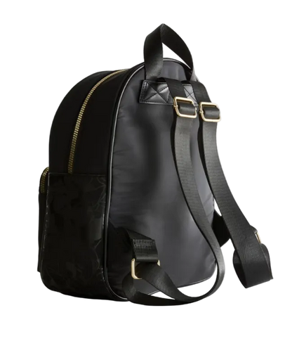 Black backpack with gold zippers on a light gray background