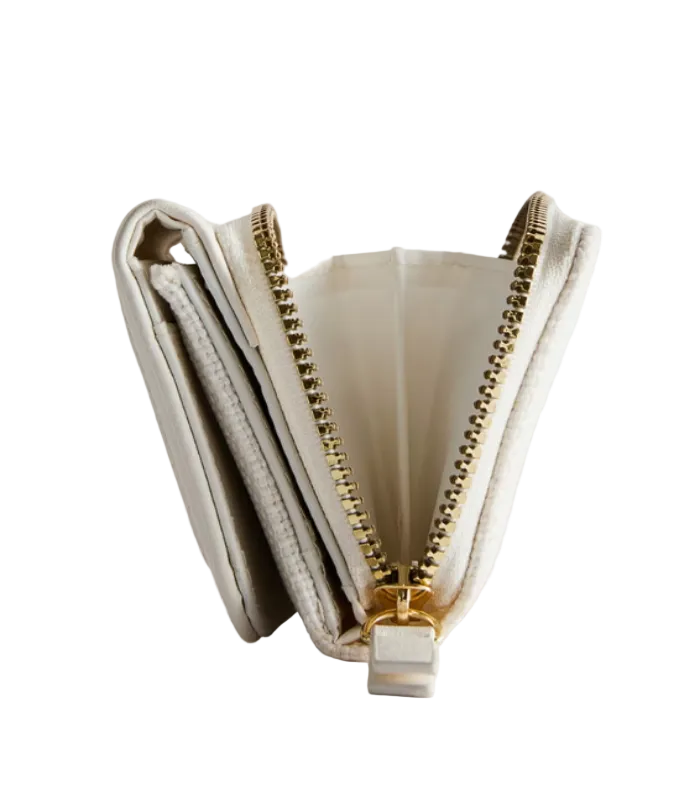 Open beige clutch with gold zipper on a light gray background