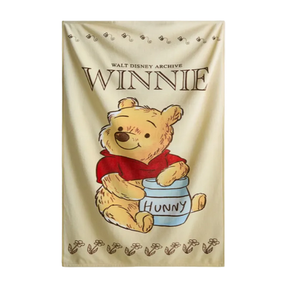 Winnie the Pooh towel with a jar of honey on a beige background