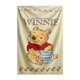 Winnie the Pooh towel with a jar of honey on a beige background