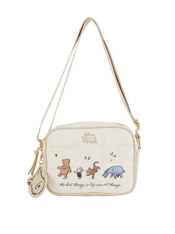 Crossbody bag with illustrations of characters and text on a white background