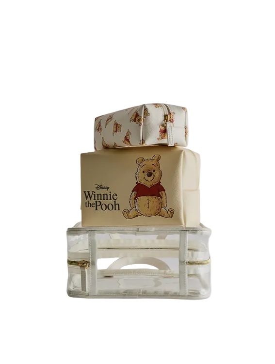 Winnie the Pooh-themed gift box with a clear container underneath on a white background