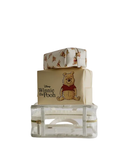 Winnie the Pooh-themed gift box with a clear container underneath on a white background