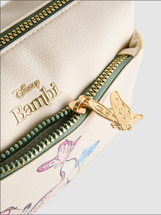 Close-up of a Disney Bambi-themed product with gold zipper pull and green accents.