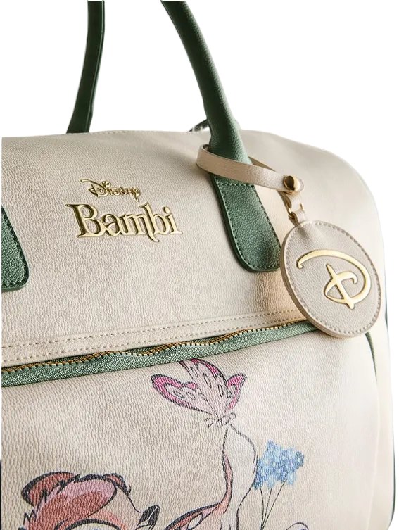 Handbag with Disney Bambi branding and floral design on a light background