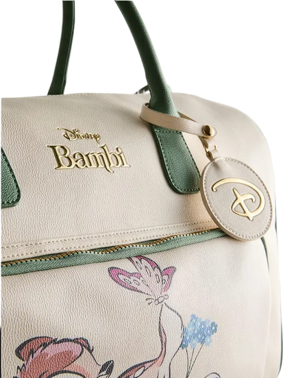 Handbag with Disney Bambi branding and floral design on a light background