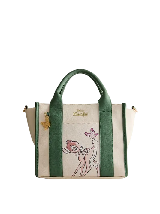 Handbag with green straps and a character design on a light gray background