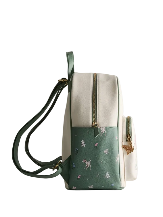 Green and beige backpack with floral pattern on a white background