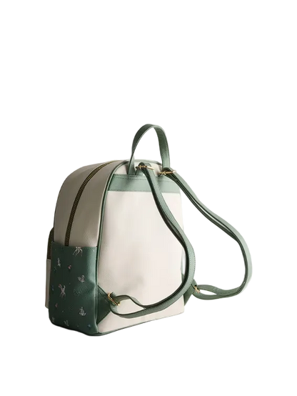 Green and beige backpack on a light gray background
