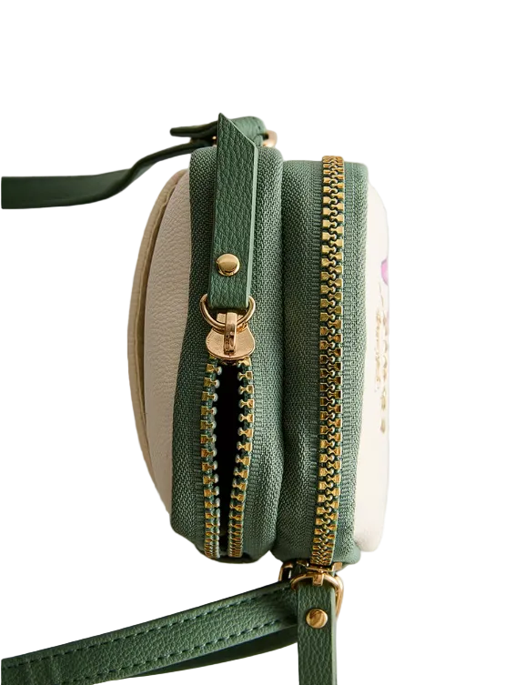 Green crossbody bag with gold zipper on a light gray background