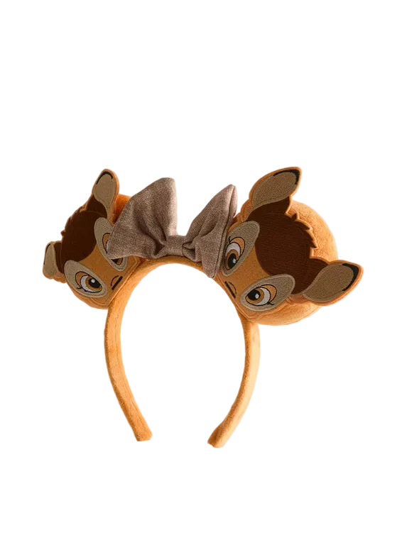 Brown animal-themed headband with ears and bow on a light gray background