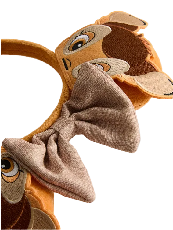 Deer headband with a bow on a light gray background