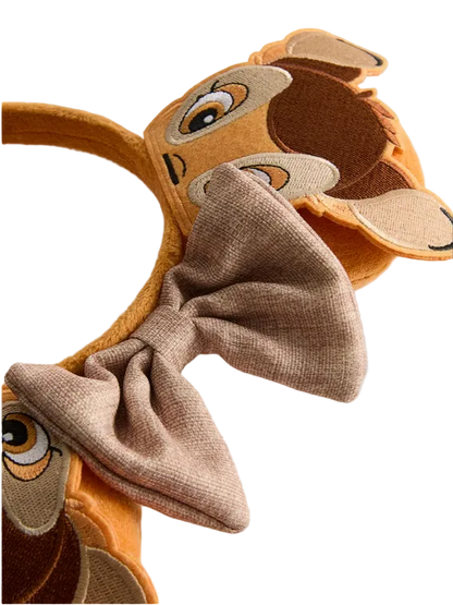Deer headband with a bow on a light gray background