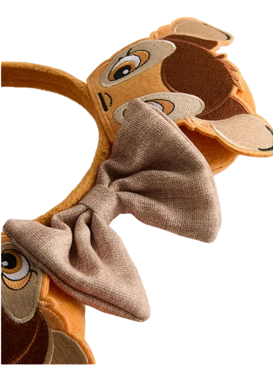 Deer headband with a bow on a light gray background