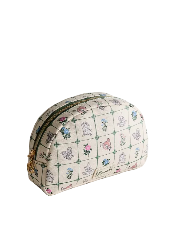 Cosmetic bag with floral and animal pattern on a light gray background