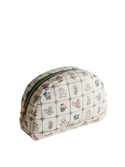 Cosmetic bag with floral and animal pattern on a light gray background