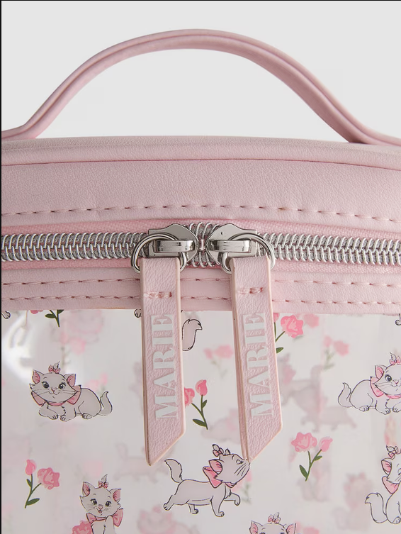 Pink cosmetic bag with floral and cat pattern, featuring a visible brand tag.