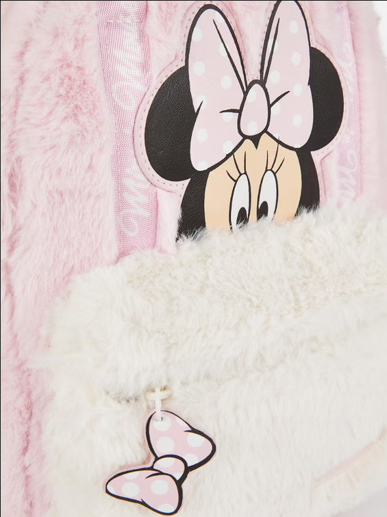 Close-up of a plush toy with Minnie Mouse design on a pink and white background