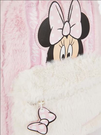 Close-up of a plush toy with Minnie Mouse design on a pink and white background