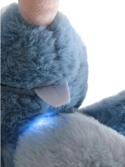 Close-up of a blue plush toy with a blurred background