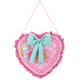 Heart-shaped pink pillow with a blue bow and toy figure on a white background