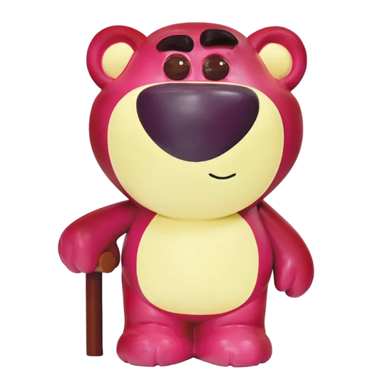 Toy figure of a pink and yellow bear with a purple nose on a white background