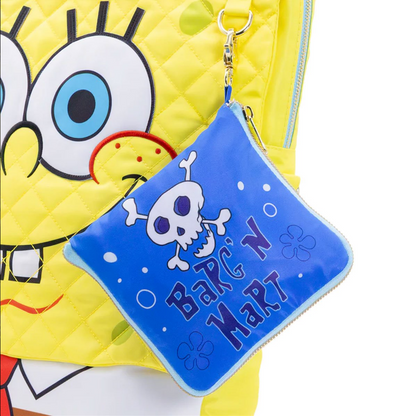Blue pouch with skull design and text in front of a yellow character with a large blue eye.