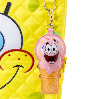 Pink ice cream cone-shaped keychain with a cartoon face on a yellow background