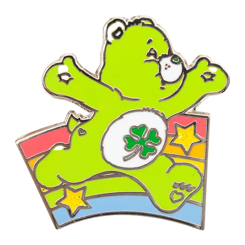 Colorful bear-shaped pin with a shamrock design on a white background