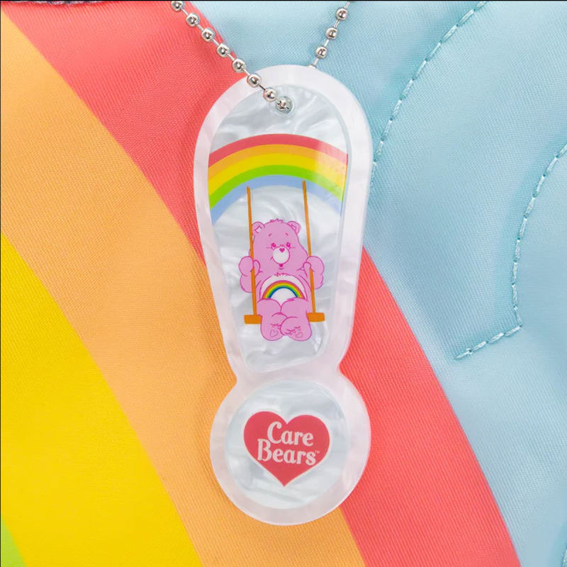 Clear sandal-shaped pendant with a pink Care Bear character on a colorful background