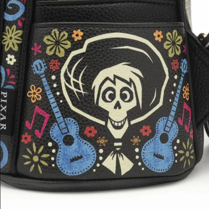 Handbag with a skeleton design and guitars, featuring Pixar branding.
