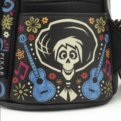 Handbag with a skeleton design and guitars, featuring Pixar branding.