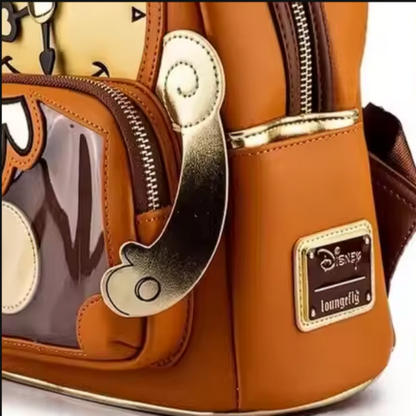 Brown backpack with gold accents and a Disney label on a white background