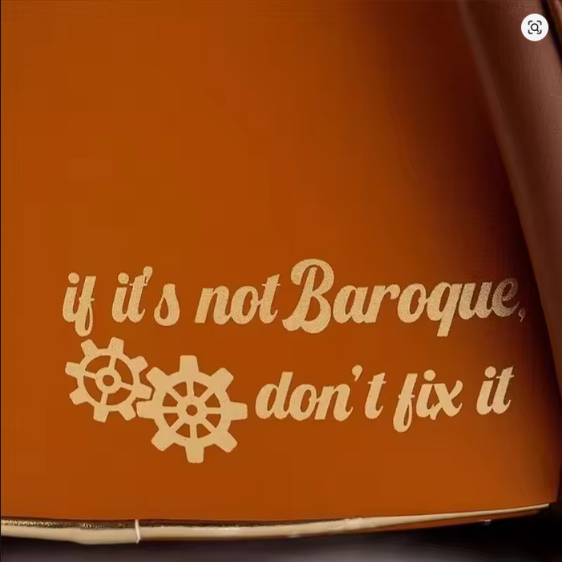 Brown surface with decorative text and gears on a dark background