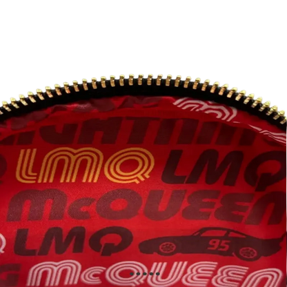 Red bag with gold and black text and graphics, featuring the brand 'LMQ McQueen'.