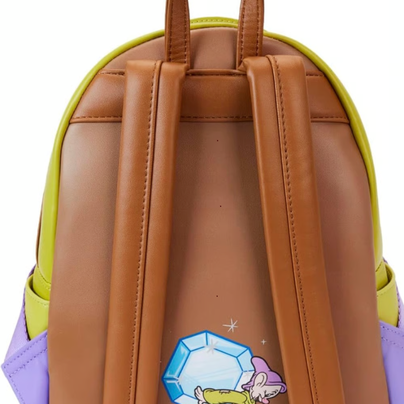 Backpack with brown leather straps and a colorful design on a white background