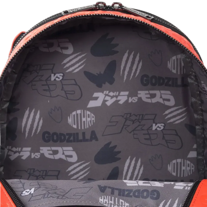 Backpack interior with Godzilla vs Mothra pattern on a gray background