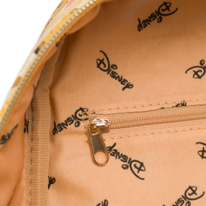 Close-up of a beige bag with Disney logo pattern and gold zipper.