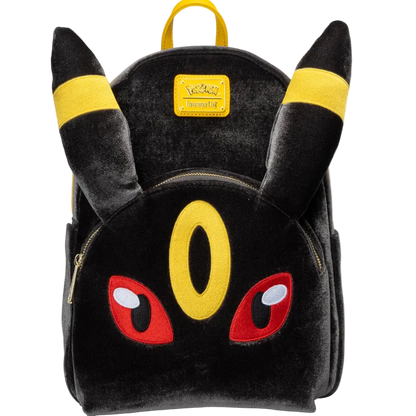 A plush black Pikachu-themed backpack with yellow ear bands, a yellow Pokémon logo patch, and red embroidered eyes on a white background.