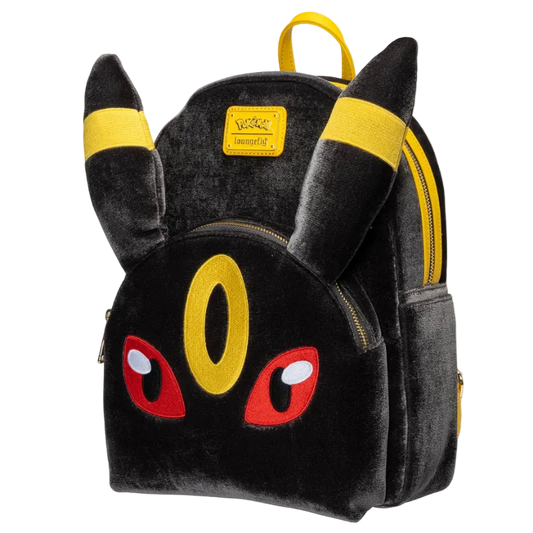 A black plush Pikachu-themed backpack with yellow ear bands, a yellow eye detail, red embroidered eyes, and gold zippers, shown on a plain white background.