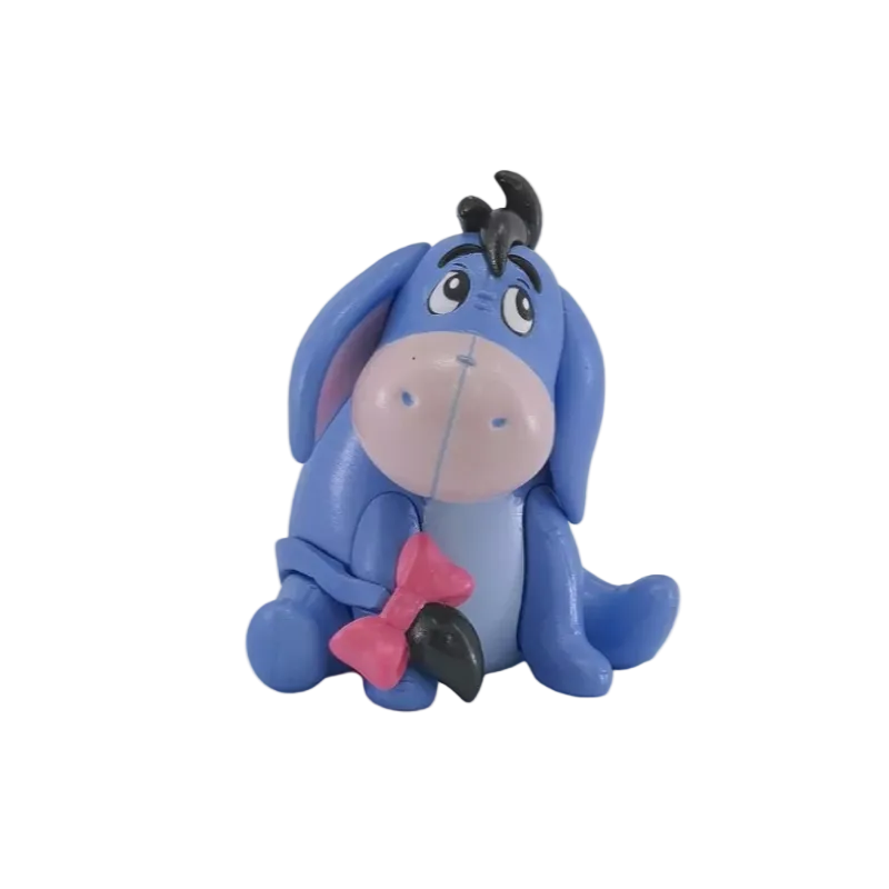 A small blue cartoon donkey figurine with a pink snout, black hair tuft, and pink bow, shown on a plain white background.