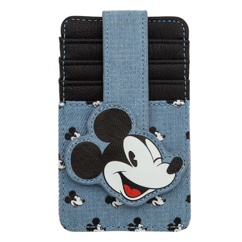 A Disney Mickey Mouse card holder wallet in a light blue denim-like material with black and white Mickey pattern, featuring a large Mickey head patch on the front and a black card slot compartment.
