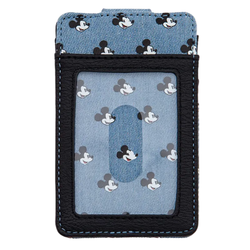 A Disney-themed card holder wallet featuring a light blue denim-like pattern with black, white, and gray Mickey Mouse silhouettes, framed by a black faux-leather border with light blue stitching.