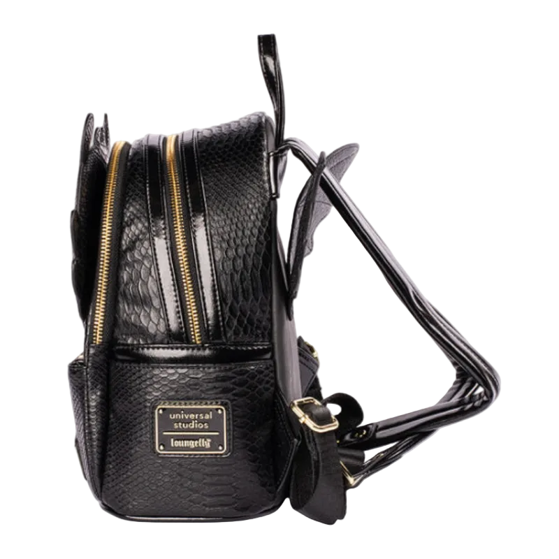 A black faux-snakeskin textured mini backpack with gold zippers and a gold-tone logo plate reading 'universal studios loungegang', shown on a white background.