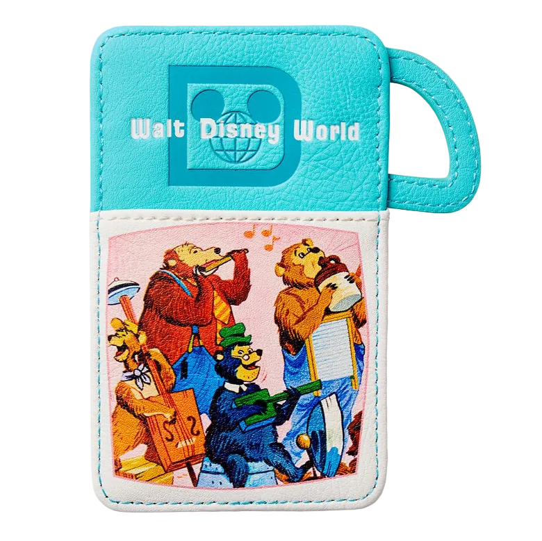 A turquoise and white faux leather luggage tag featuring the Walt Disney World logo and a colorful cartoon illustration of park characters playing instruments on the front pocket.