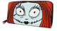 A zip-around wallet featuring a cartoon face with large white eyes, black stitched details, and red hair on a white background.