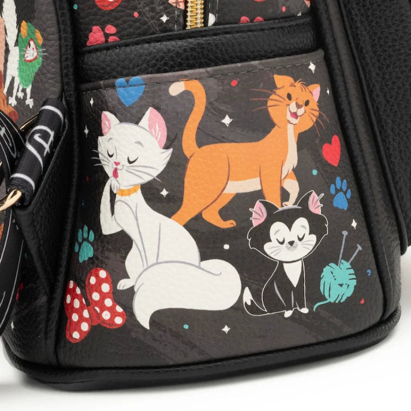 Backpack with cartoon cat designs on a black background