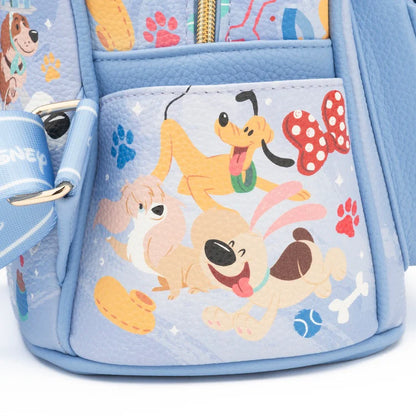 Backpack with cartoon dog characters and colorful paw prints on a light blue background