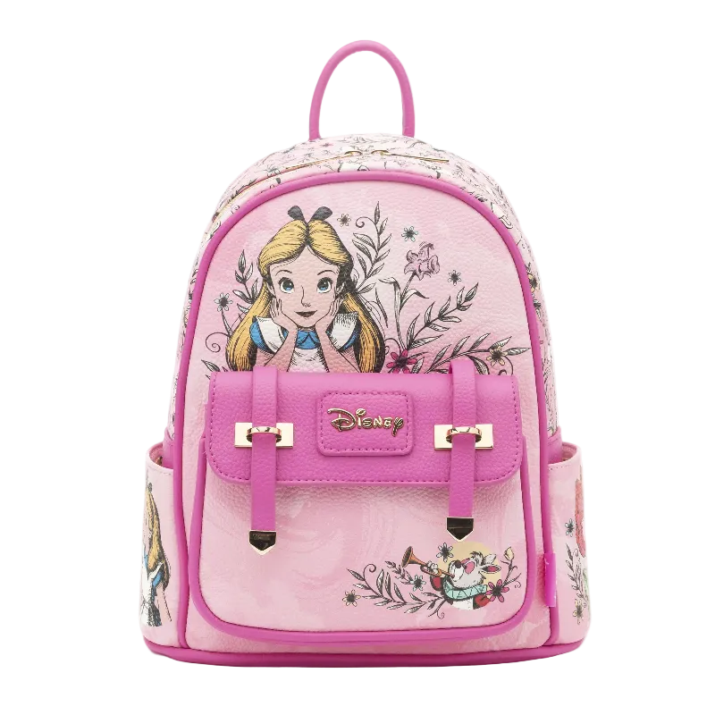 A pink Disney-themed mini backpack featuring Alice in Wonderland artwork, including Alice and the Cheshire Cat, with a prominent pink front pocket and a gold-tone Disney logo.