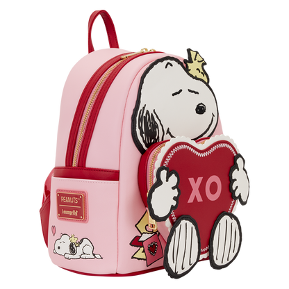 Pink backpack with cartoon character holding a heart and 'XO' text on a white background
